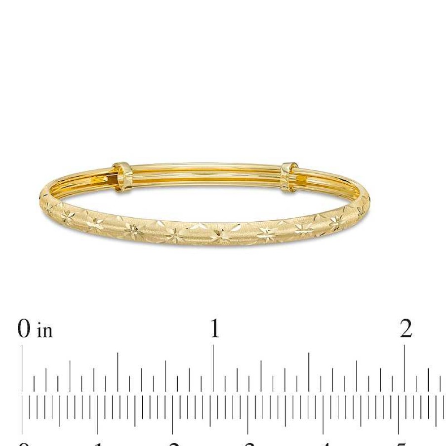 Zales Child'S Diamond-Cut Flower Bangle In 14K Gold Bracelets