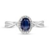 Zales Oval Blue Sapphire And 1/15 Ct. T.W. Diamond Frame Twist Shank Ring In 10K White Gold Rings