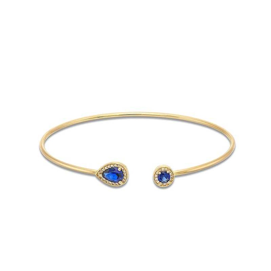 Zales Pear-Shaped And Round Blue Lab-Created Sapphire With 1/8 Ct. T.W. Diamond Open Flex Bangle In 10K Gold Bracelets