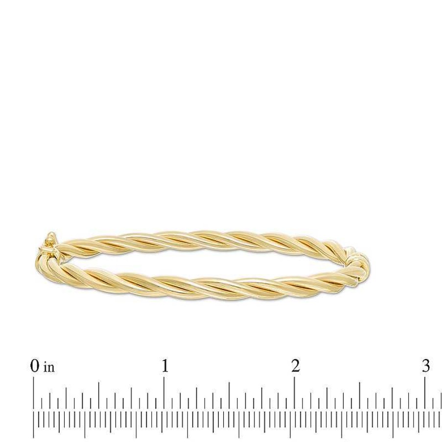 Zales Italian Gold 60.0 X 50.0 X 4.0Mm Twist Bangle In Hollow 14K Gold Bracelets