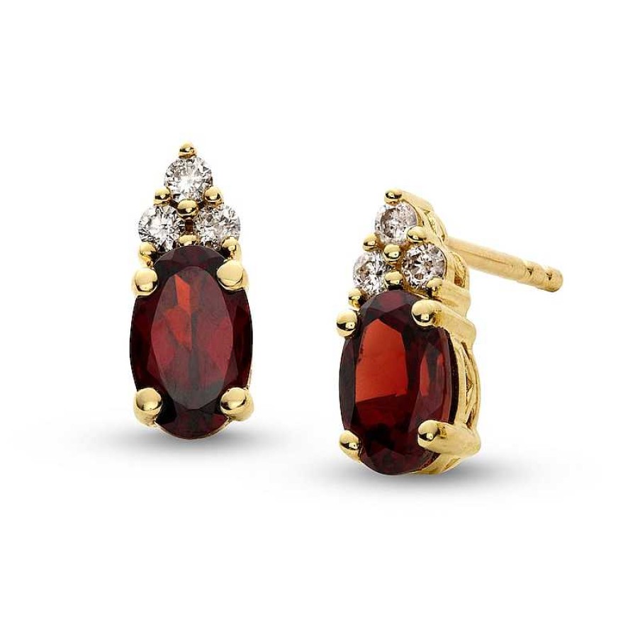 Zales Oval Garnet And 1/10 Ct. T.W. Diamond Stud Earrings In 10K Gold Earrings