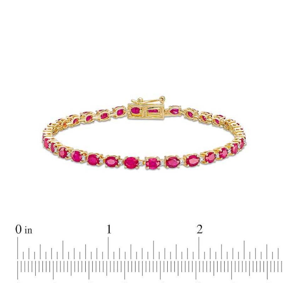 Zales Oval Ruby And 1/6 Ct. T.W. Diamond Alternating Line Bracelet In 10K Gold Bracelets