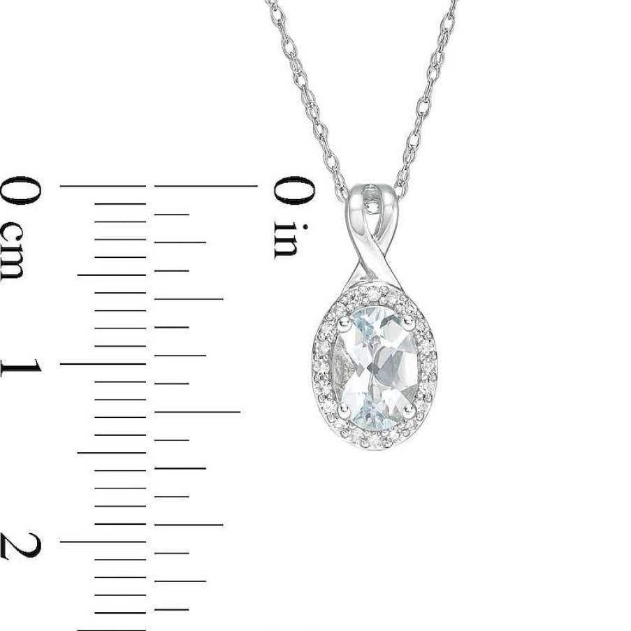 Zales Oval Aquamarine And 1/15 Ct. T.W. Diamond Frame Pendant In 10K White Gold Necklaces