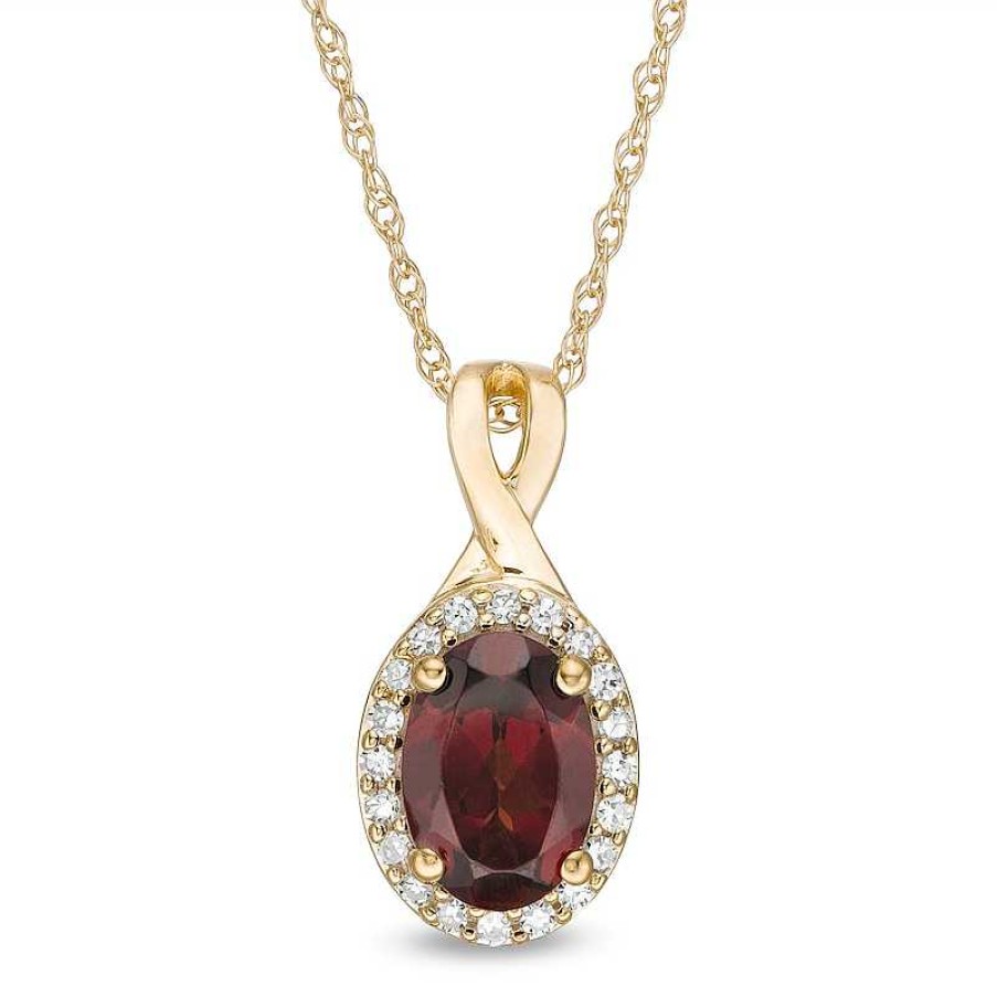 Zales Oval Garnet And 1/15 Ct. T.W. Diamond Frame Pendant In 10K Gold Necklaces