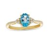 Zales Oval Swiss Blue Topaz And 1/10 Ct. T.W. Diamond Ring In 10K Gold Rings