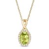 Zales Oval Peridot And 1/15 Ct. T.W. Diamond Frame Pendant In 10K Gold Necklaces