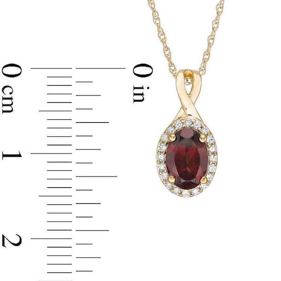 Zales Oval Garnet And 1/15 Ct. T.W. Diamond Frame Pendant In 10K Gold Necklaces