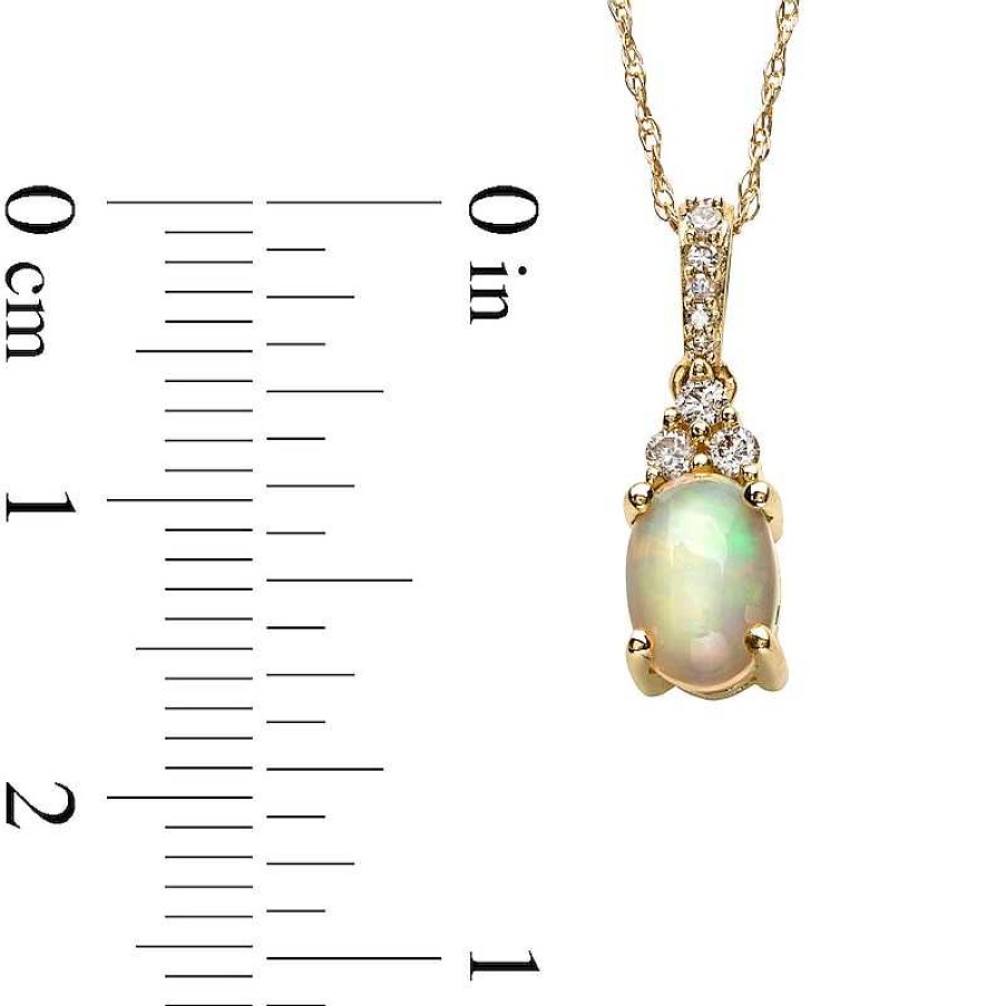 Zales Oval Opal And 1/15 Ct. T.W. Diamond Pendant In 10K Gold Necklaces