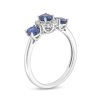 Zales Oval Blue Lab-Created Sapphire And 1/8 Ct. T.W. Diamond Starburst Frame Three Stone Ring In 10K White Gold Rings