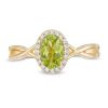 Zales Oval Peridot And 1/15 Ct. T.W. Diamond Frame Twist Shank Ring In 10K Gold Rings