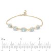 Zales Oval Swiss Blue Topaz And Diamond Accent Twist Five Stone Bracelet In 10K Gold 8.0" Bracelets