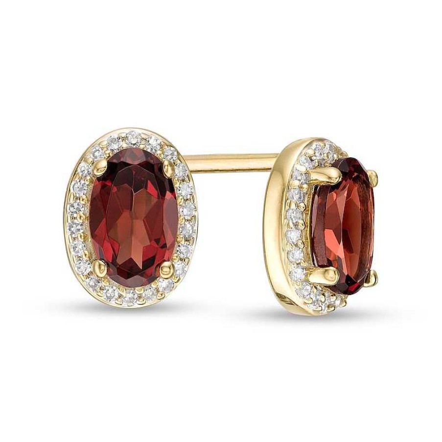 Zales Oval Garnet And 1/10 Ct. T.W. Diamond Frame Stud Earrings In 10K Gold Earrings