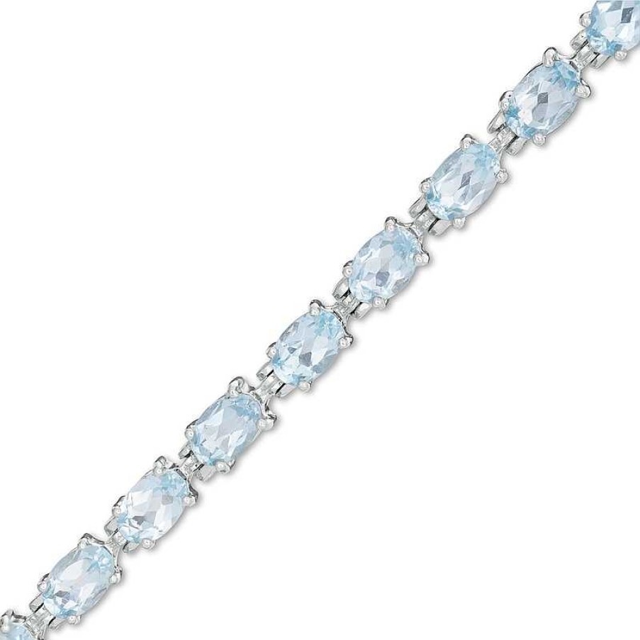 Zales Sideways Oval Blue Topaz Tennis Bracelet In Sterling Silver - 7.5" Bracelets