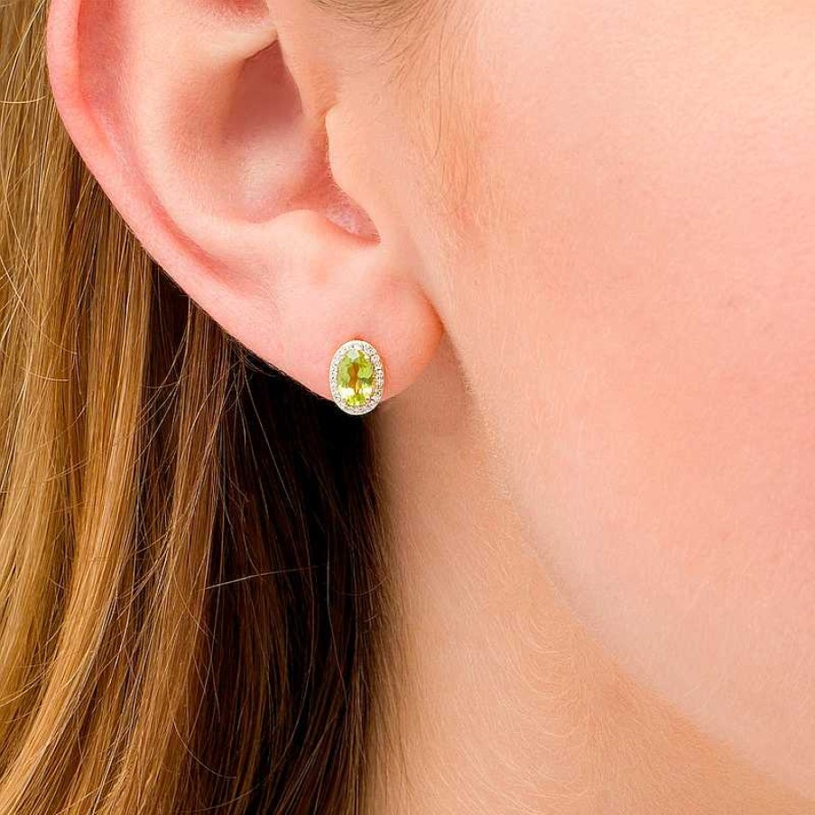 Zales Oval Peridot And 1/10 Ct. T.W. Diamond Frame Stud Earrings In 10K Gold Earrings