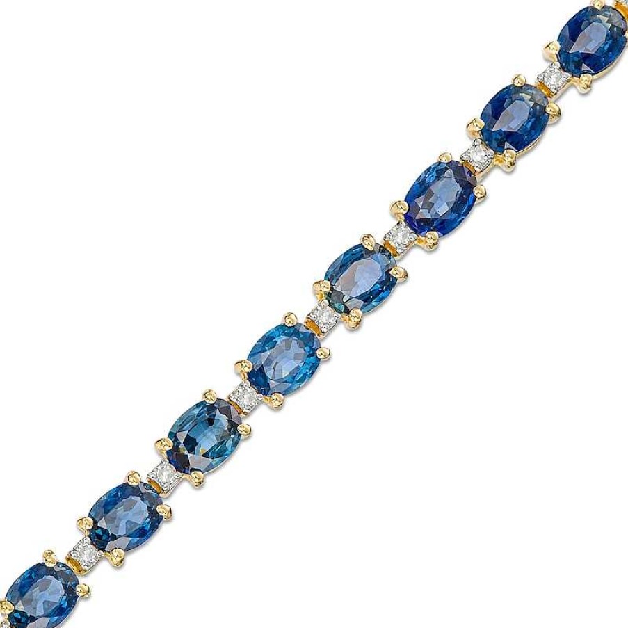 Zales Oval Blue Sapphire And 1/6 Ct. T.W. Diamond Alternating Line Bracelet In 10K Gold Bracelets