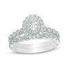 Zales 3/4 Ct. T.W. Oval Diamond Double Frame Twist Vintage-Style Bridal Set In 14K White Gold Rings