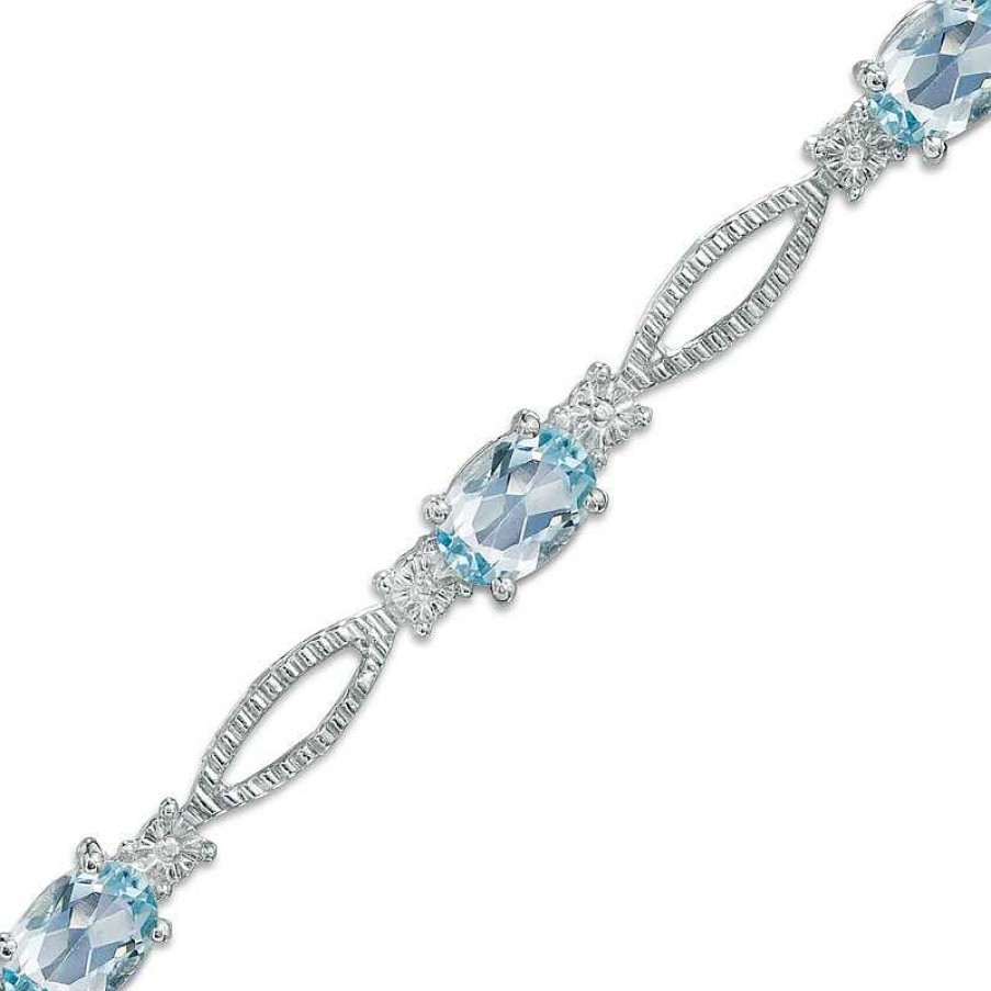 Zales Oval Blue Topaz And Diamond Accent Bracelet In Sterling Silver - 7.25" Bracelets