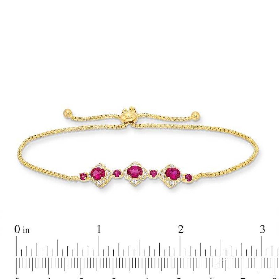 Zales Oval Certified Ruby And 1/5 Ct. T.W. Diamond Flower Frame Three Stone Bolo Bracelet In 10K Gold - 9" Bracelets