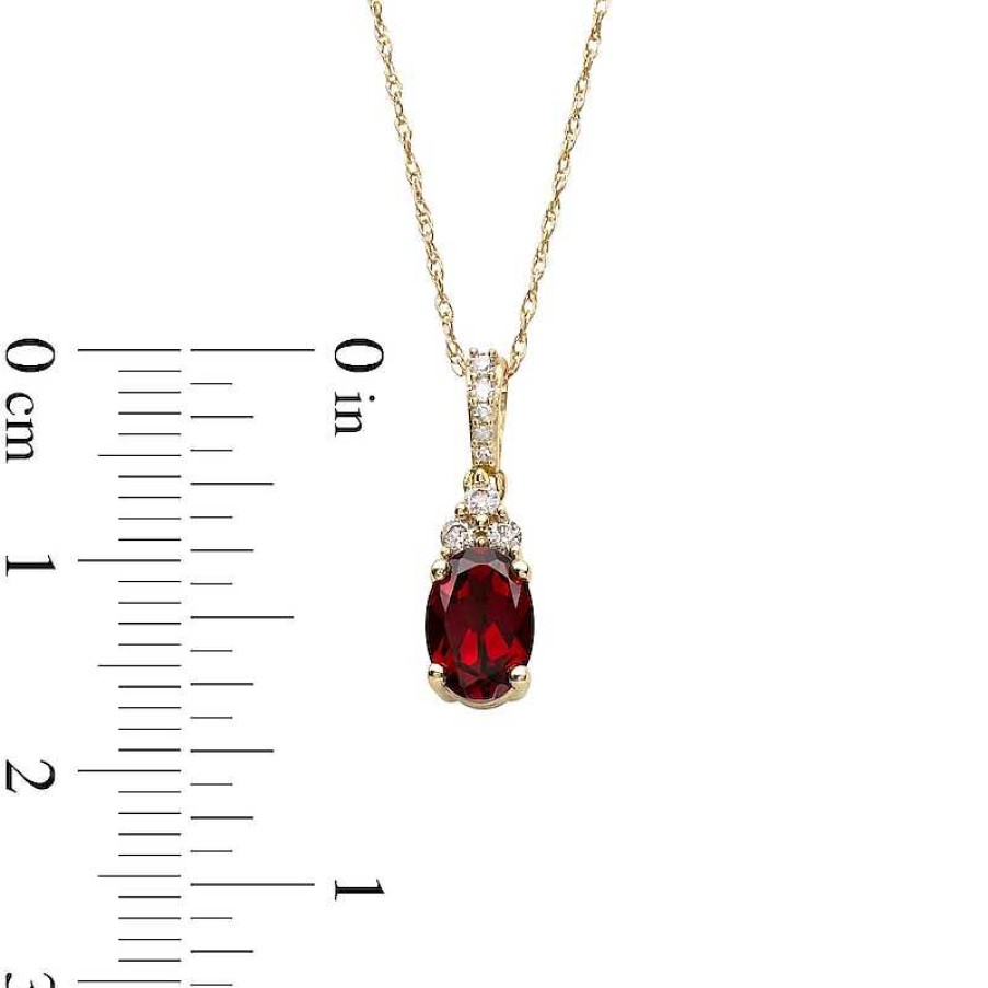 Zales Oval Garnet And 1/15 Ct. T.W. Diamond Pendant In 10K Gold Necklaces