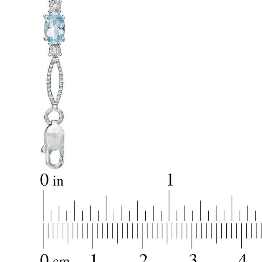 Zales Oval Blue Topaz And Diamond Accent Bracelet In Sterling Silver - 7.25" Bracelets