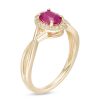 Zales Oval Ruby And 1/15 Ct. T.W. Diamond Frame Twist Shank Ring In 10K Gold Rings