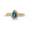 Zales Pear-Shaped London Blue Topaz And 1/5 Ct. T.W. Diamond Frame Twist Shank Ring In 10K Gold Rings