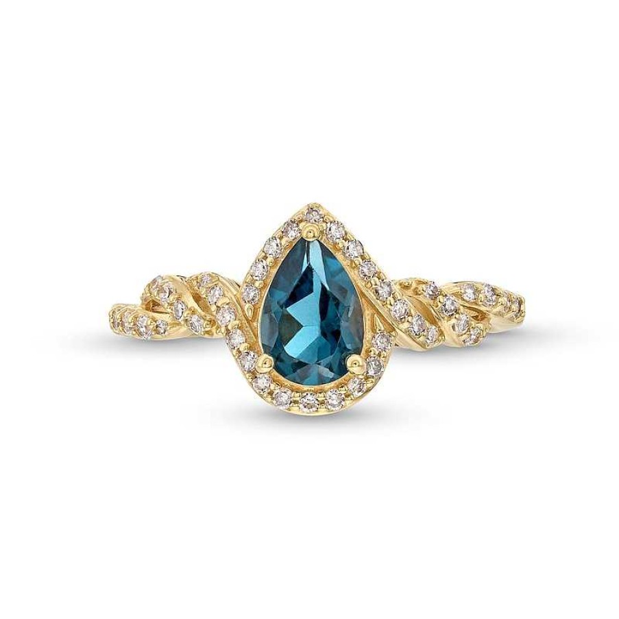 Zales Pear-Shaped London Blue Topaz And 1/5 Ct. T.W. Diamond Frame Twist Shank Ring In 10K Gold Rings