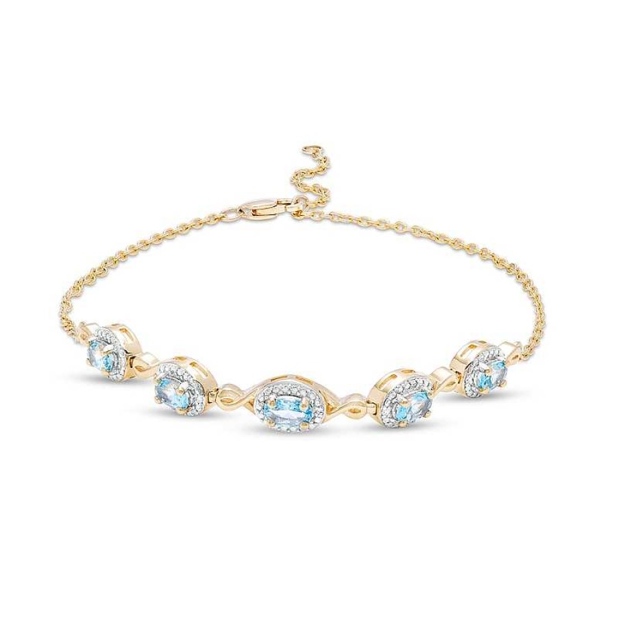 Zales Oval Swiss Blue Topaz And Diamond Accent Twist Five Stone Bracelet In 10K Gold 8.0" Bracelets